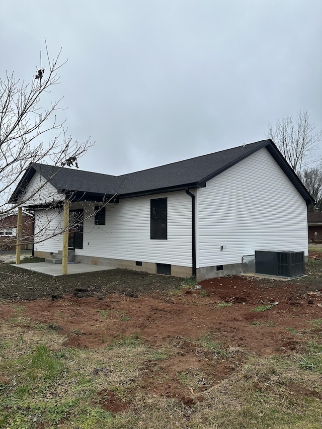 view of home's exterior with cooling unit, crawl space, and a patio