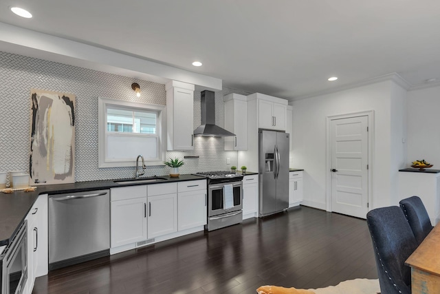 kitchen featuring white cabinets, sink, wall chimney exhaust hood, and appliances with stainless steel finishes