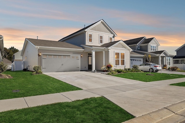 view of front of house with a lawn and a garage