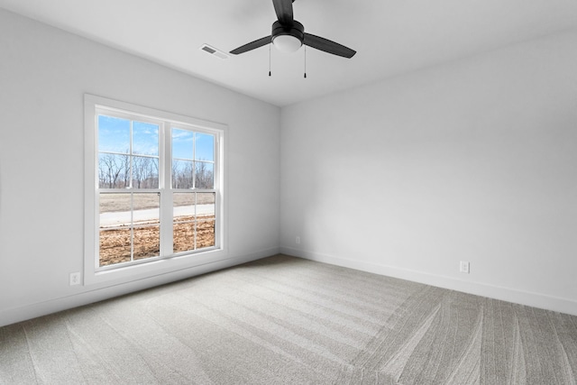 carpeted empty room with ceiling fan