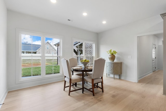 dining area featuring light wood-type flooring