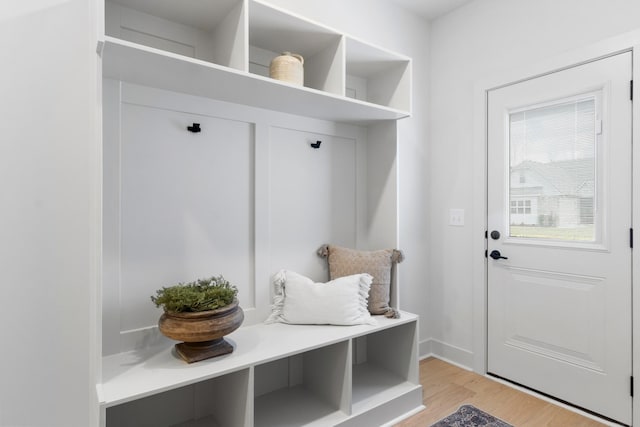 mudroom with light hardwood / wood-style floors