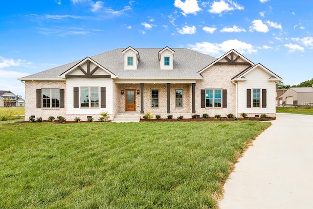 view of front of property featuring a front lawn and a porch