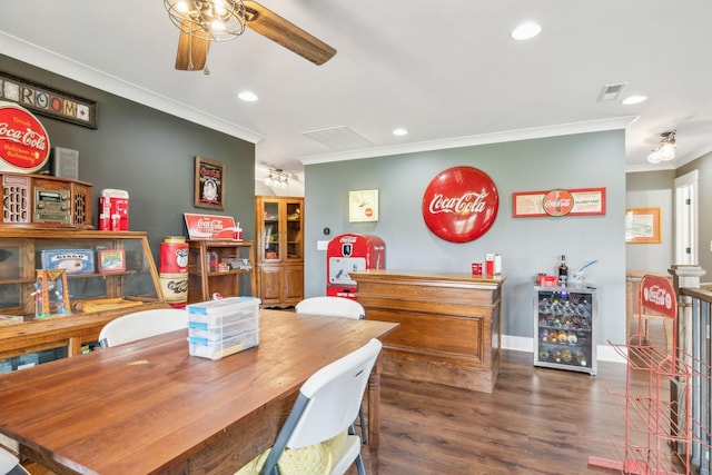 dining space featuring ceiling fan, dark hardwood / wood-style flooring, and ornamental molding