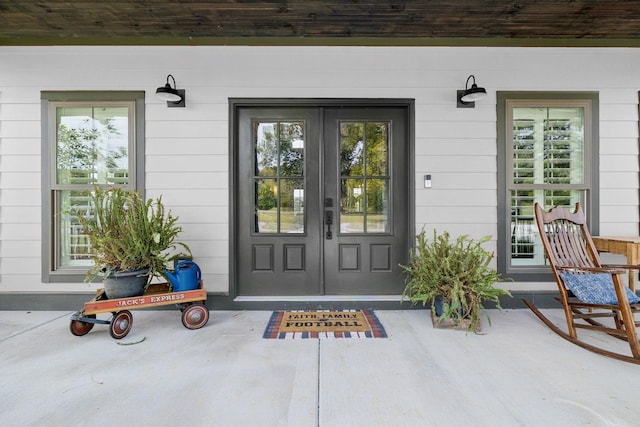 doorway to property featuring french doors and a porch