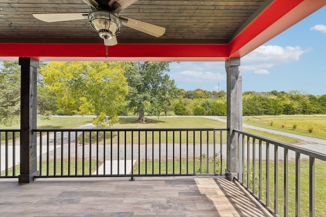 wooden terrace featuring ceiling fan