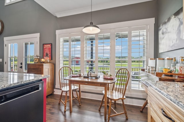 dining room featuring dark hardwood / wood-style floors, crown molding, and french doors