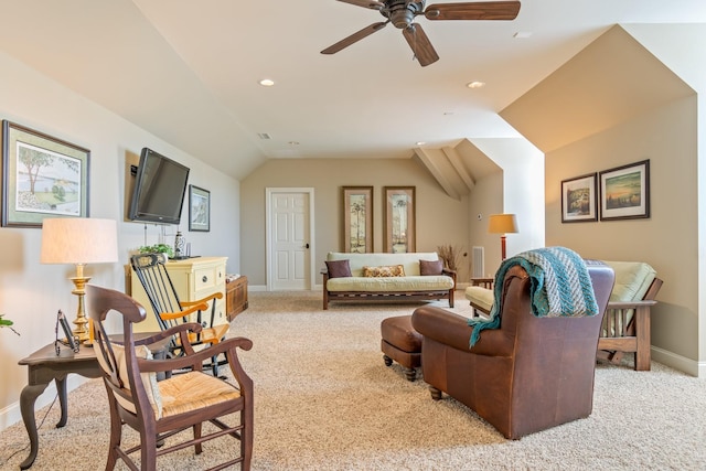 carpeted living room featuring vaulted ceiling and ceiling fan