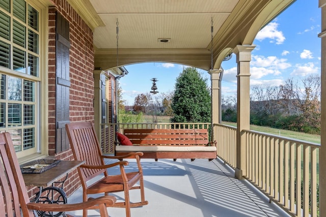 balcony featuring a porch