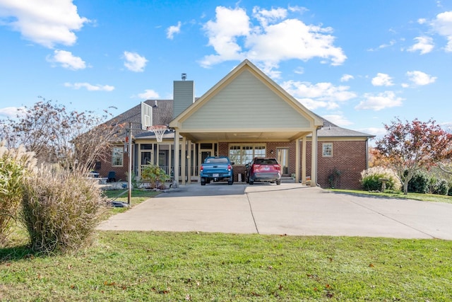 exterior space with a carport, a sunroom, and a front lawn