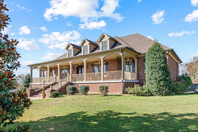 view of front facade with a porch and a front lawn