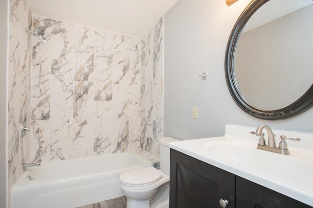 full bathroom with toilet, wood-type flooring, vanity, and tiled shower / bath combo