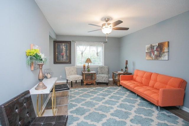 living room featuring ceiling fan and wood-type flooring