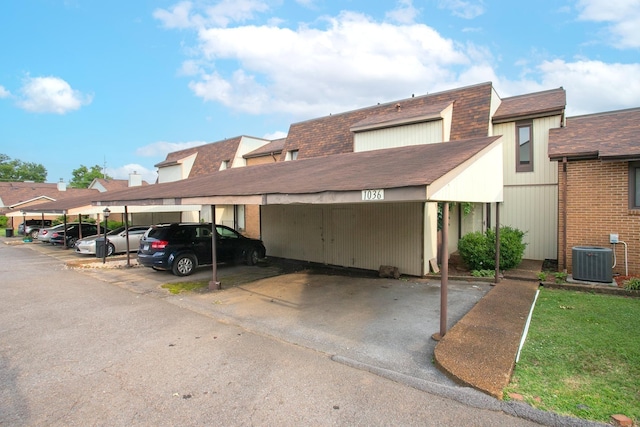 view of parking / parking lot featuring a carport