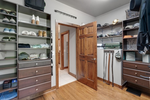 walk in closet featuring light hardwood / wood-style floors