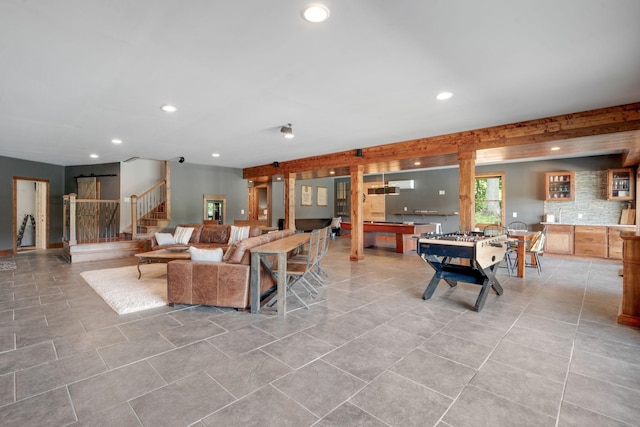 tiled living room with a barn door