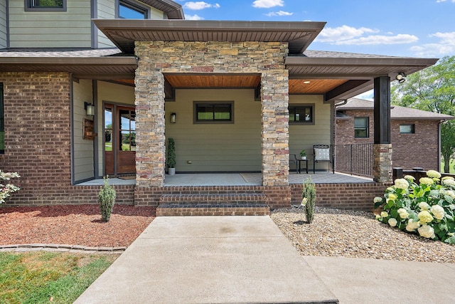 property entrance featuring covered porch