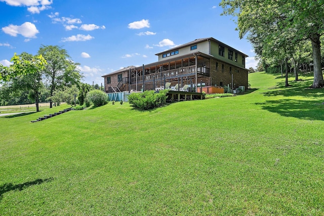 exterior space with a wooden deck and a yard