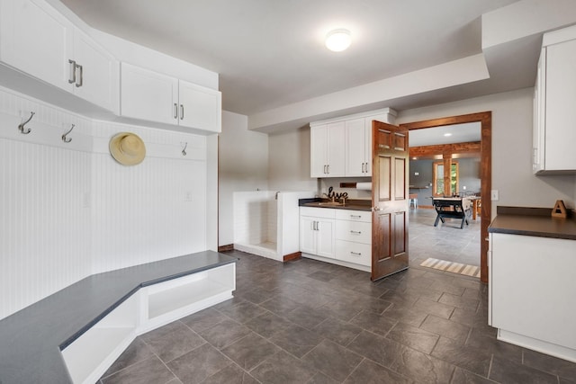 kitchen with white cabinetry and sink