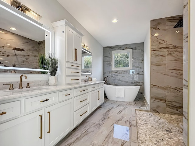 bathroom with vanity and independent shower and bath