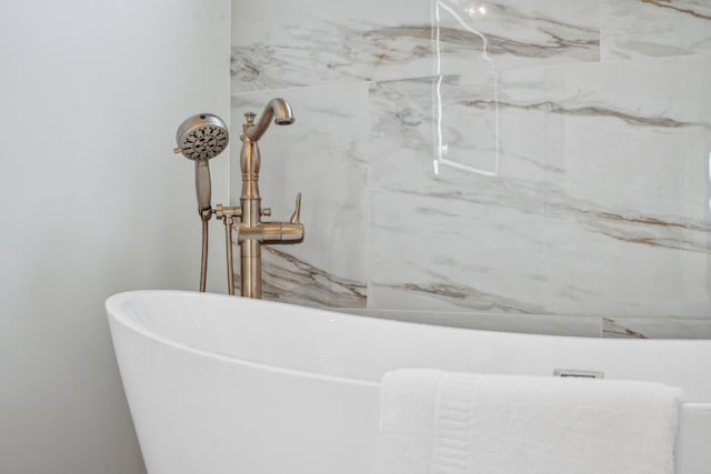 bathroom with a tub to relax in