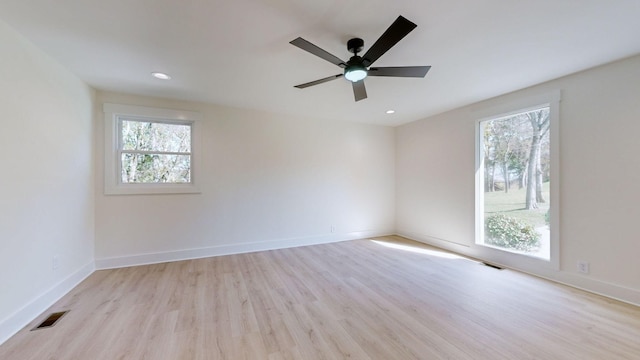 unfurnished room with light hardwood / wood-style flooring and ceiling fan