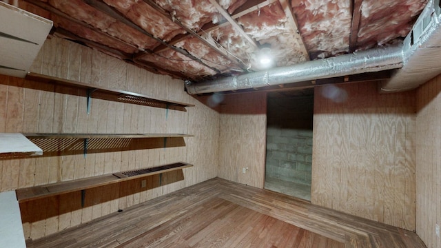 basement featuring hardwood / wood-style floors