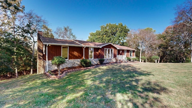 single story home featuring a front yard