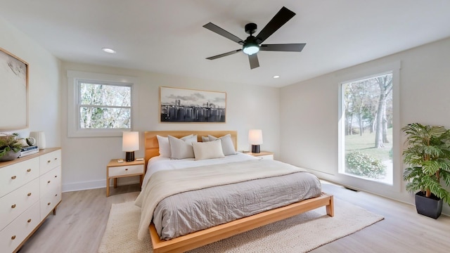 bedroom featuring ceiling fan and light wood-type flooring