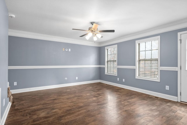 empty room with dark hardwood / wood-style flooring, ceiling fan, and crown molding