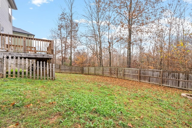 view of yard featuring a wooden deck