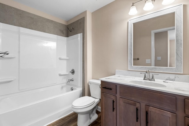 full bathroom featuring vanity, wood-type flooring,  shower combination, and toilet