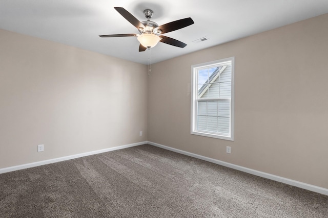 spare room with carpet flooring and ceiling fan