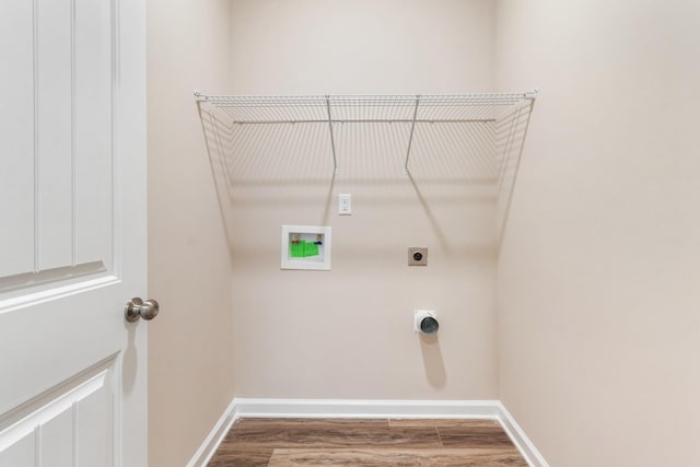 washroom featuring hookup for an electric dryer, hookup for a washing machine, and hardwood / wood-style flooring