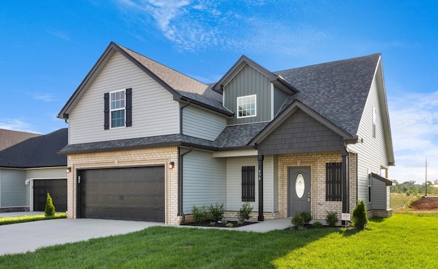 view of front of property with a front yard and a garage