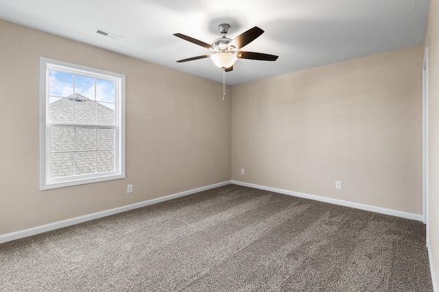 carpeted empty room featuring ceiling fan