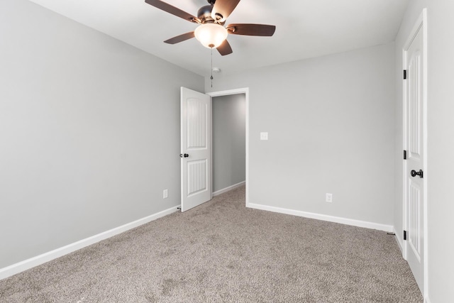 unfurnished bedroom featuring light carpet and ceiling fan