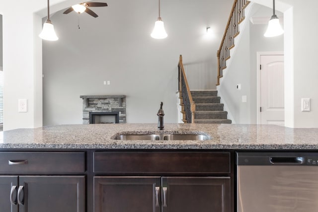 kitchen featuring dishwasher, decorative light fixtures, ceiling fan, and sink