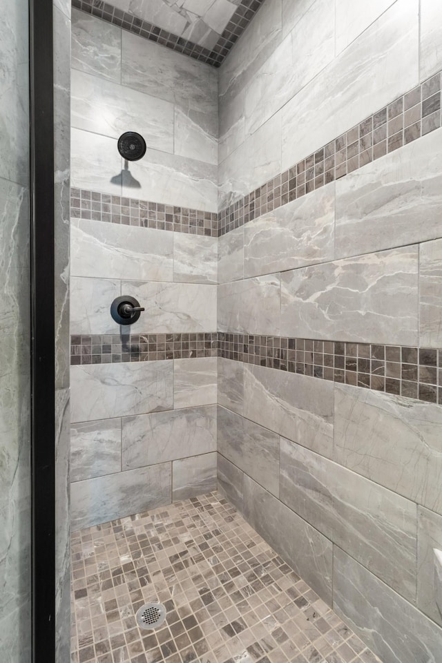 bathroom with a tile shower