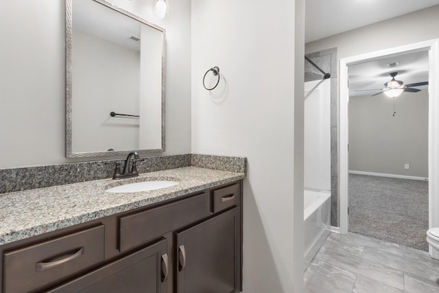 full bathroom featuring ceiling fan, vanity, shower / bath combination, and toilet