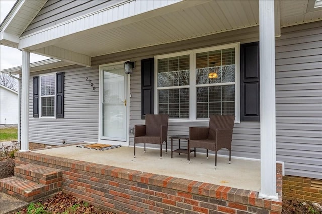 doorway to property featuring covered porch