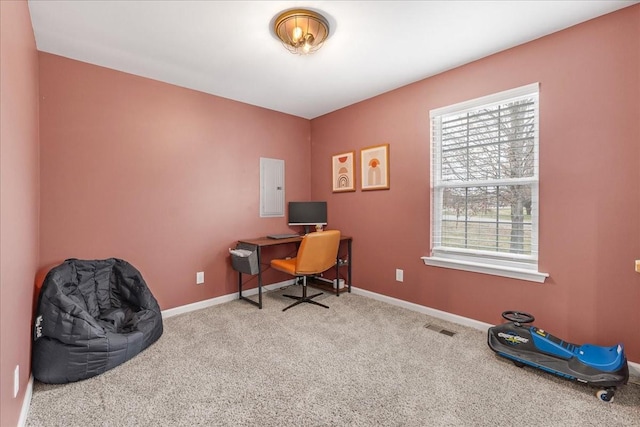 home office with electric panel and light colored carpet