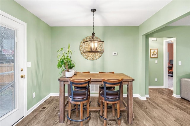 dining room featuring wood-type flooring