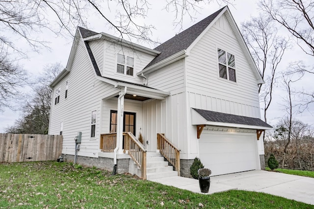 view of front of home featuring a front lawn and a garage