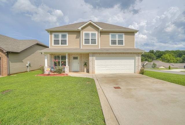 view of front of house featuring a front yard and a garage