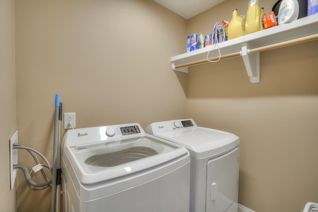 washroom featuring independent washer and dryer