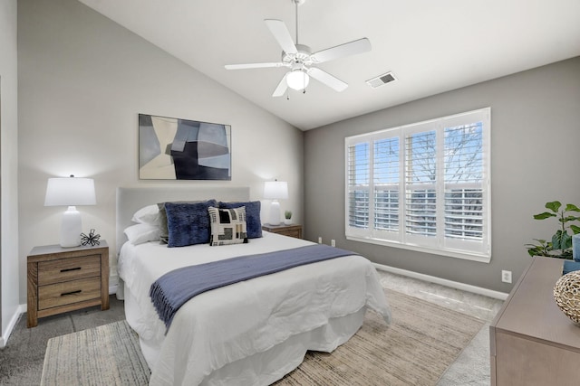 bedroom with ceiling fan, vaulted ceiling, and carpet