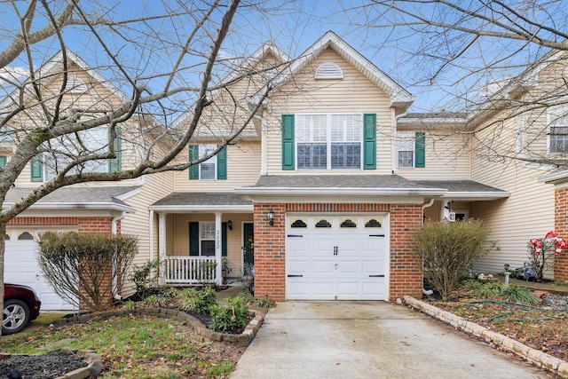 view of front property featuring a garage and a porch