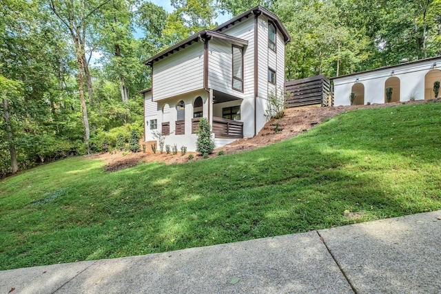 view of home's exterior with a lawn