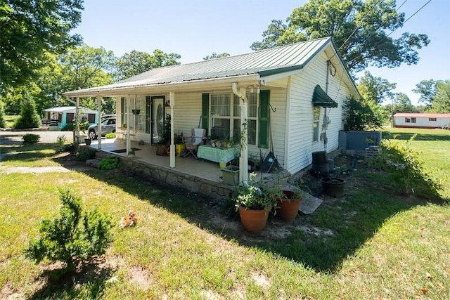 view of front of home with a front lawn and a porch